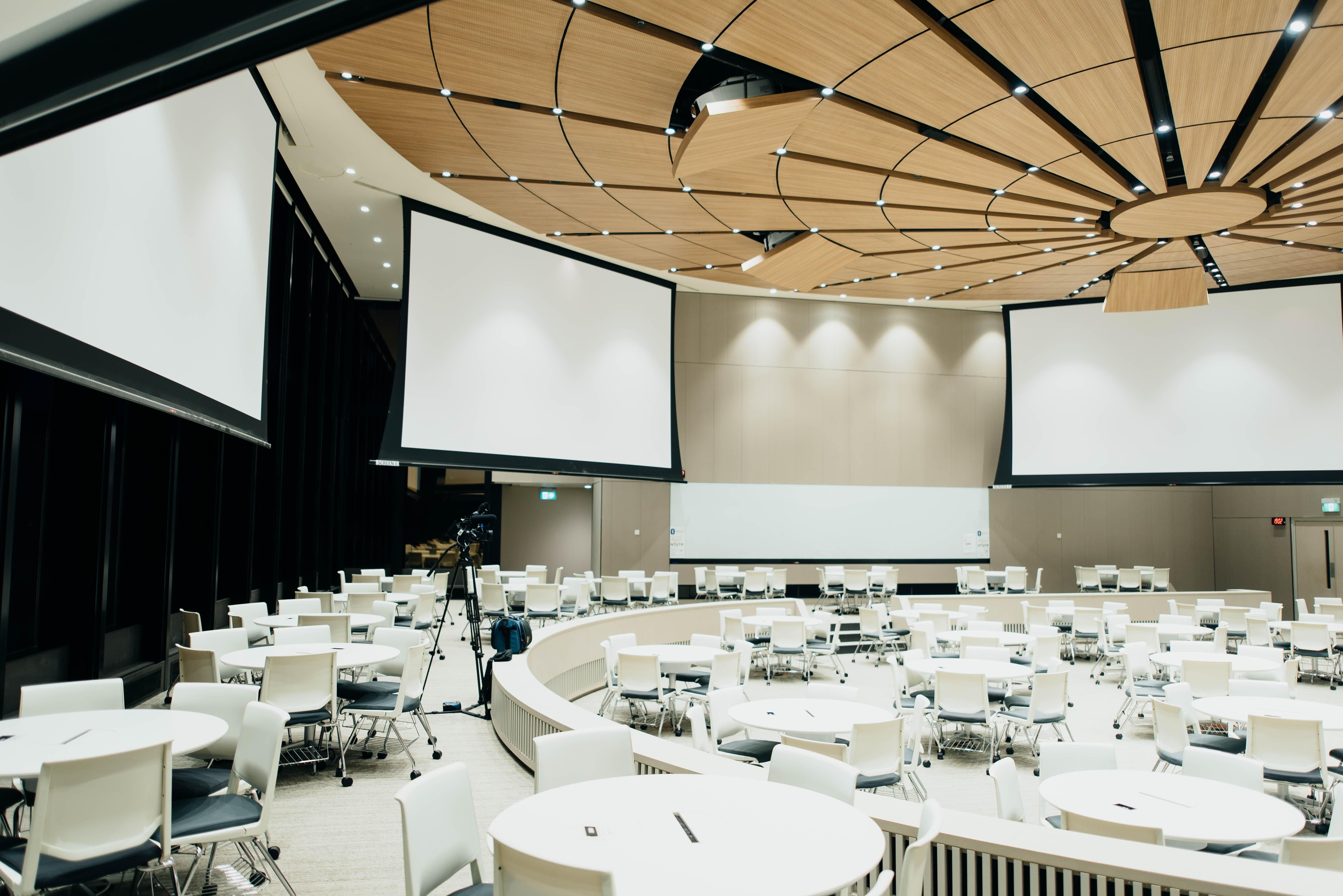 event venue with lighting technology and projector screens